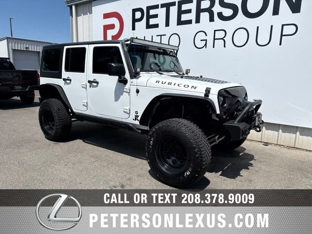 Used 2013 White Jeep Unlimited Sport image 2