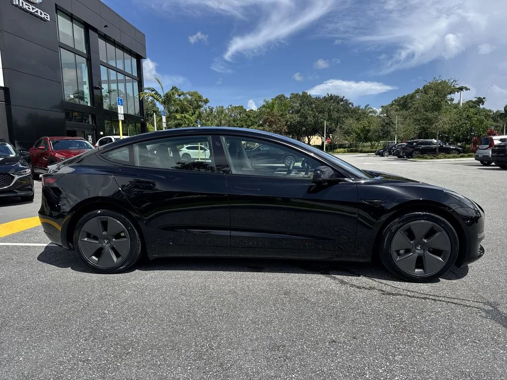 Used 2023 Solid Black Tesla  image 5