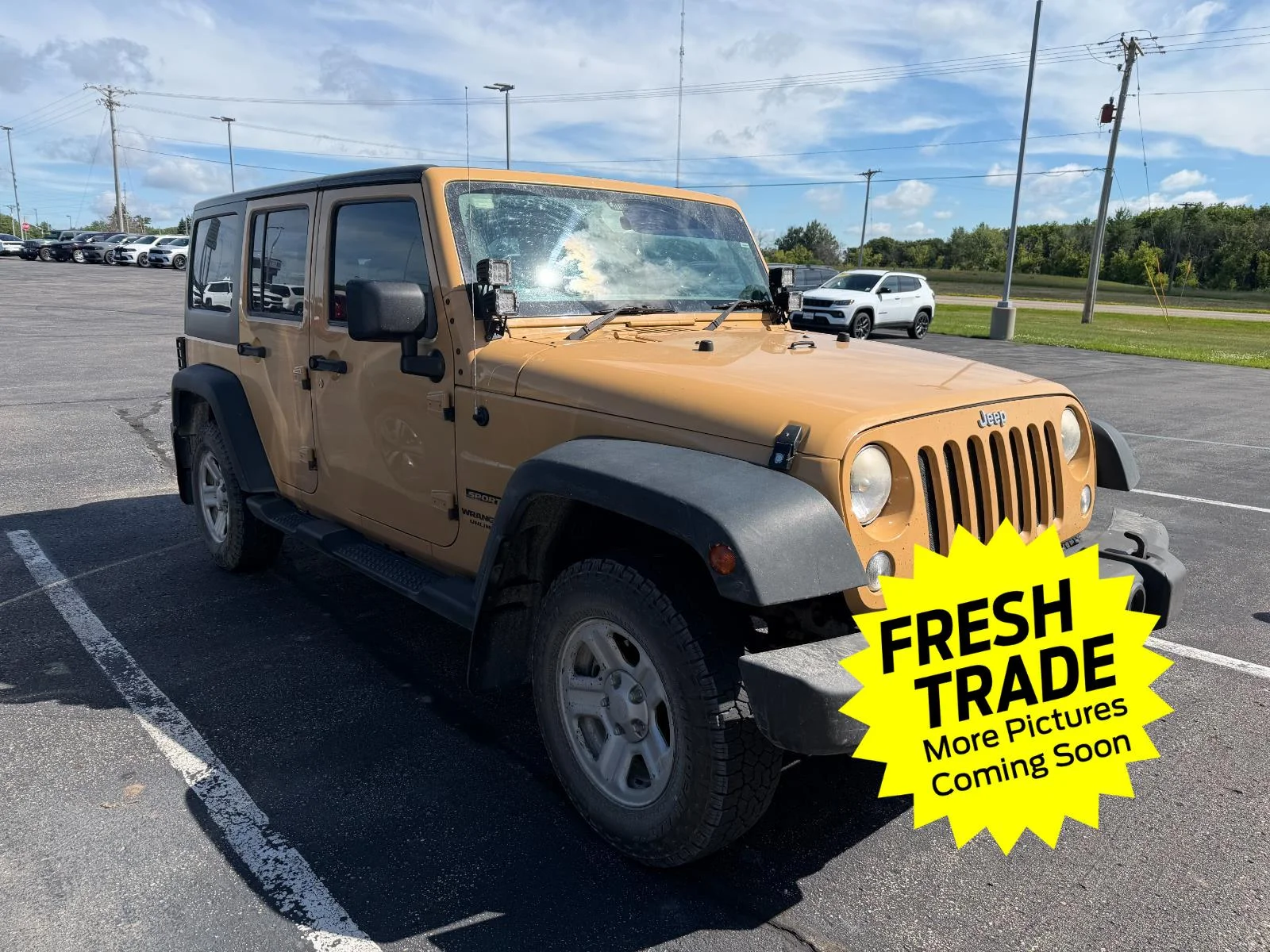 Used 2014 Jeep Wrangler Unlimited Sport with VIN 1C4BJWKG2EL242748 for sale in Charles City, IA