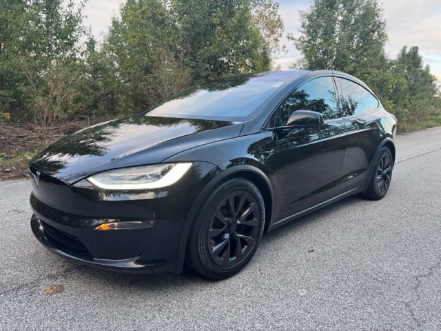 Used 2022 Solid Black Tesla Base image 1