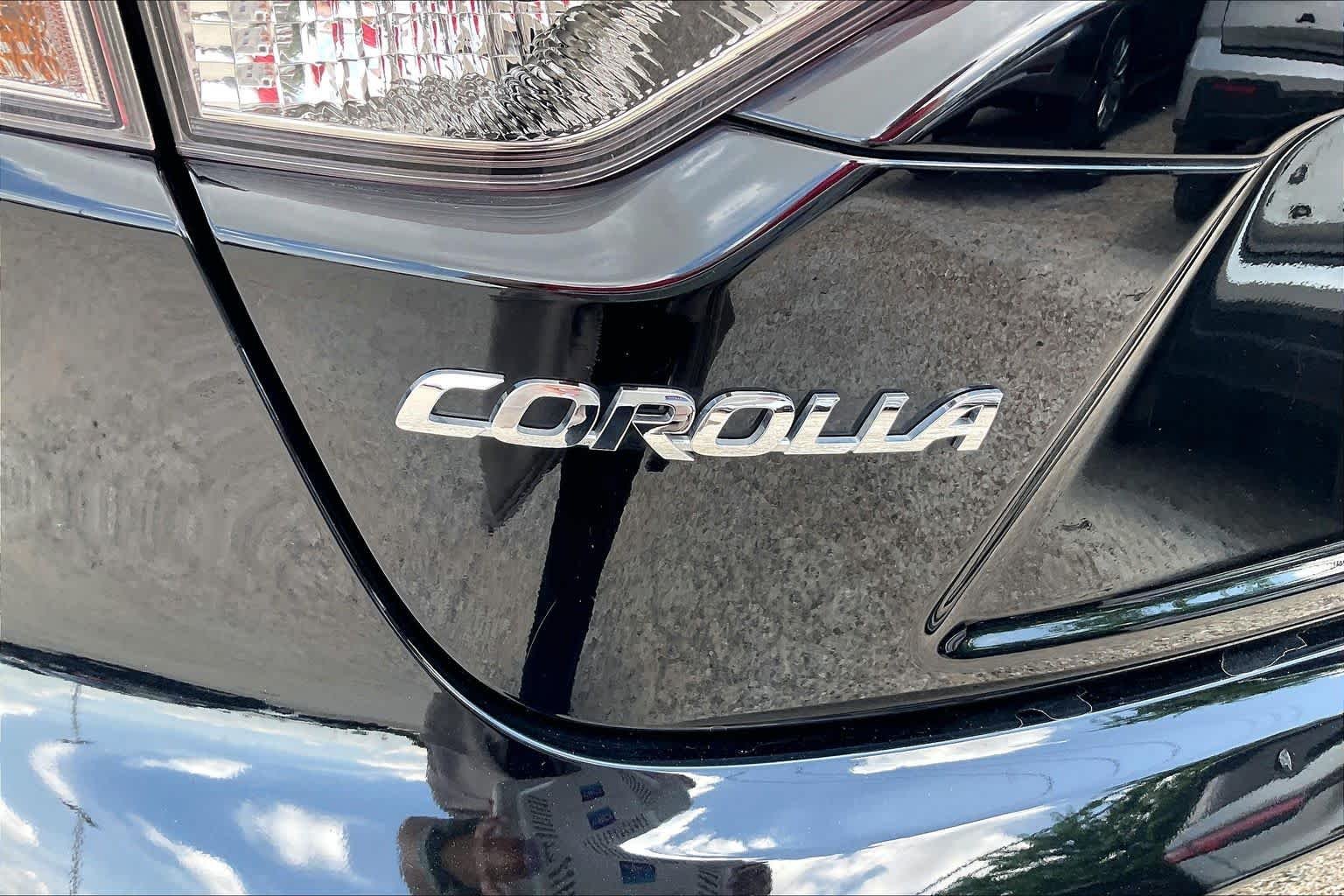 Used 2025 Midnight Black Metallic Toyota Hybrid LE image 29