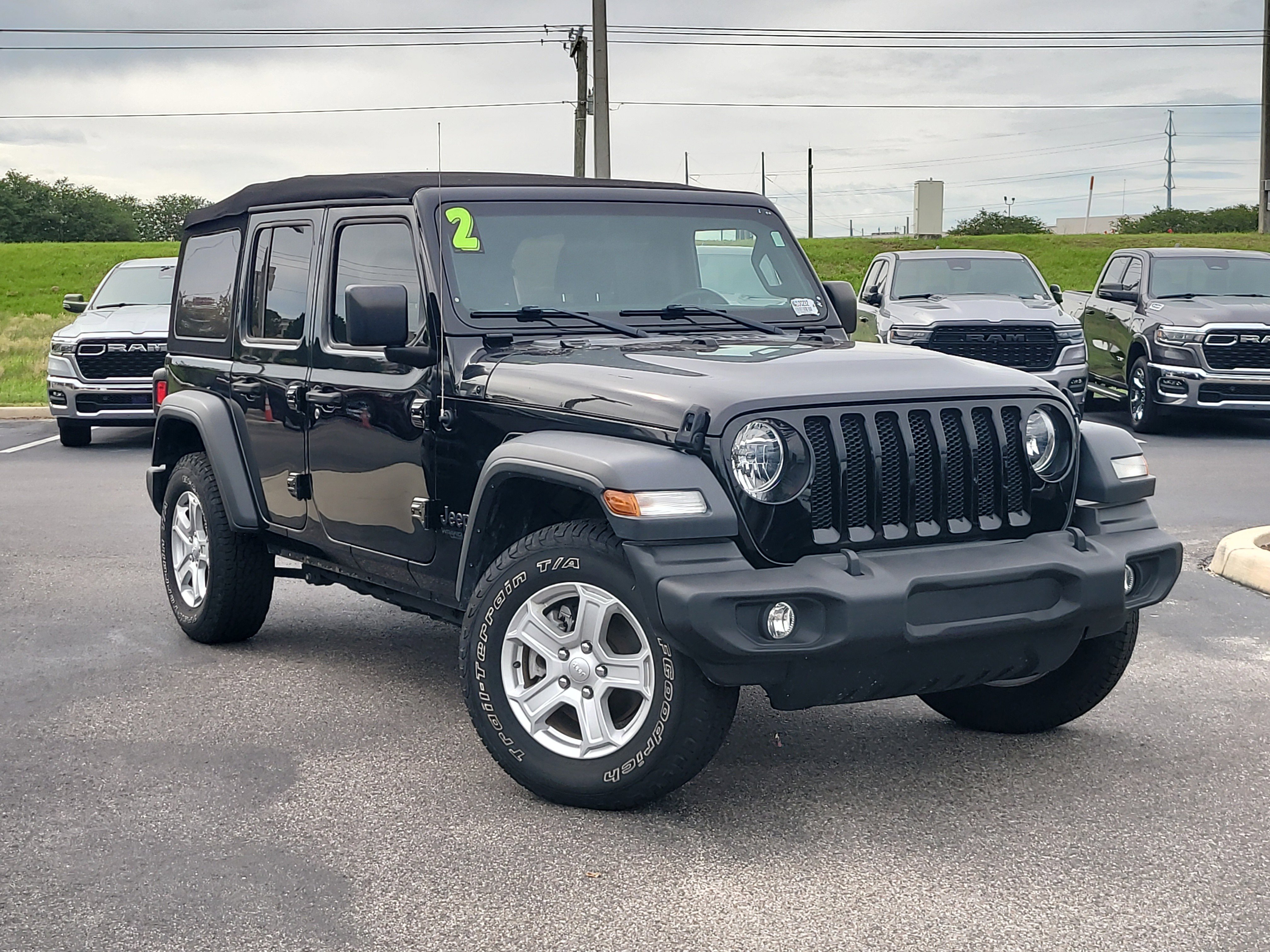 Used 2022 Black Clearcoat Jeep Unlimited Sport S image 1