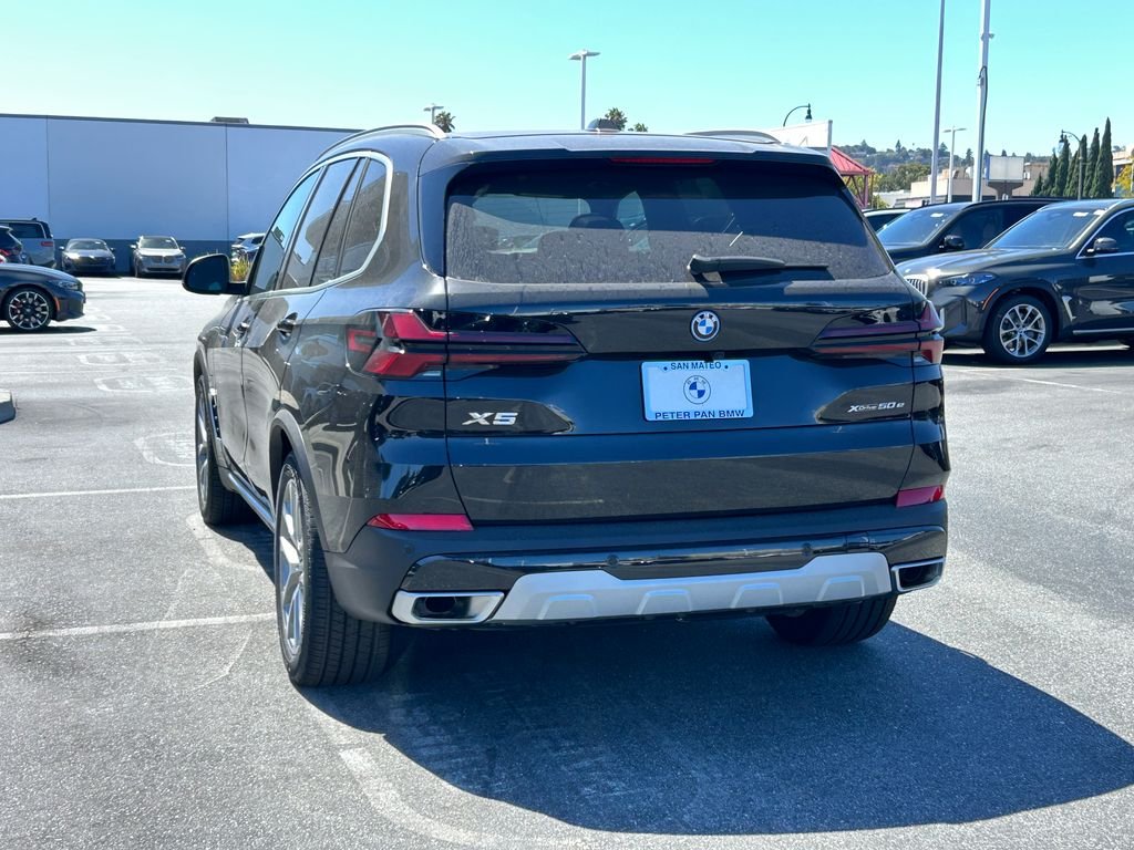New 2026 Black Sapphire Metallic BMW xDrive50e image 3