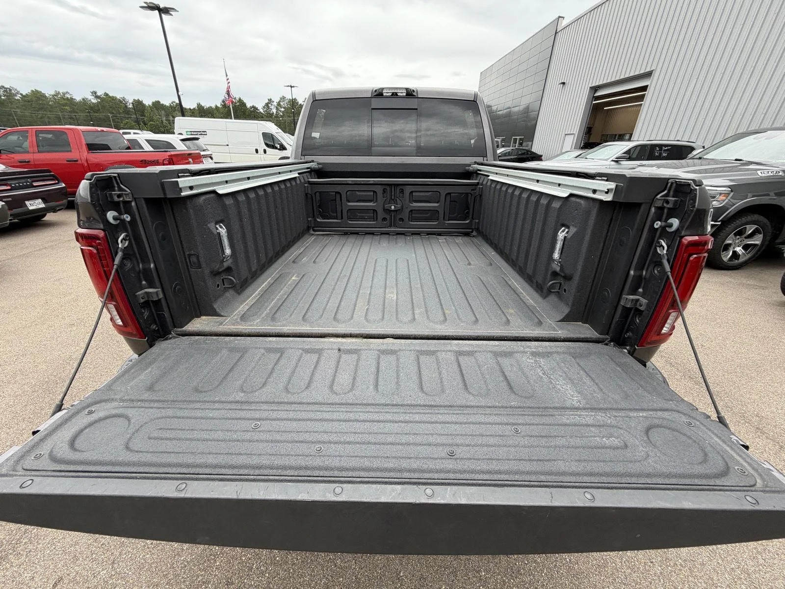 Used 2025 Granite Crystal Metallic Clearcoat Ram Rebel image 19
