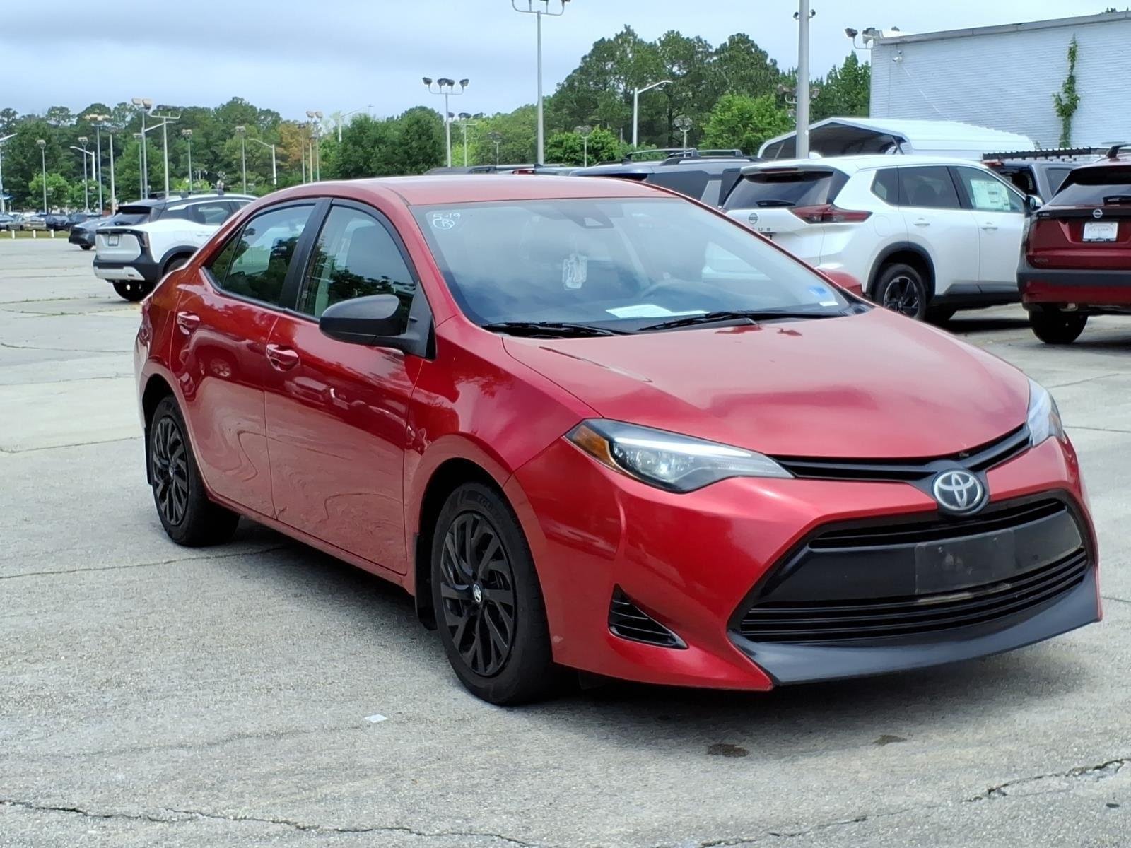 Used 2018 Barcelona Red Metallic Toyota LE image 6