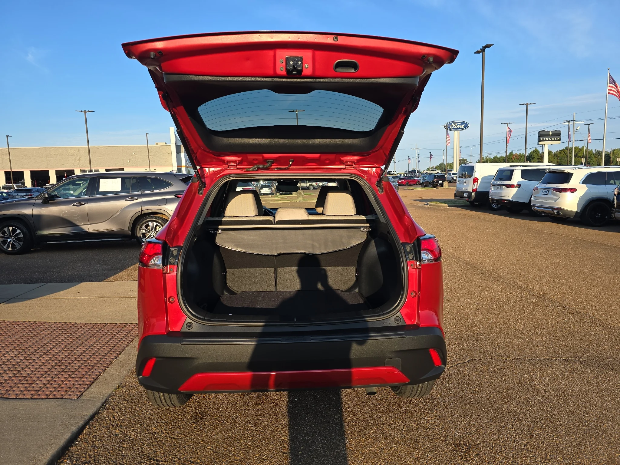 Used 2024 Barcelona Red Metallic Toyota LE image 4