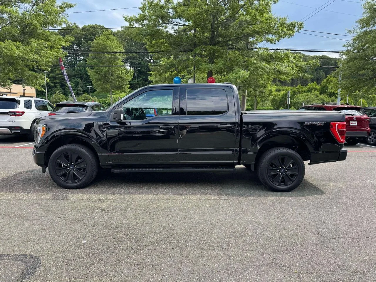 Used 2022 Agate Black Metallic Ford XLT image 4