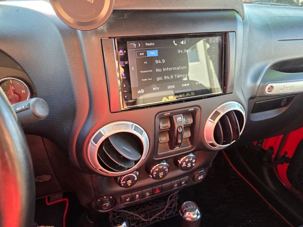 Used 2015 Red Jeep Unlimited Sahara image 19