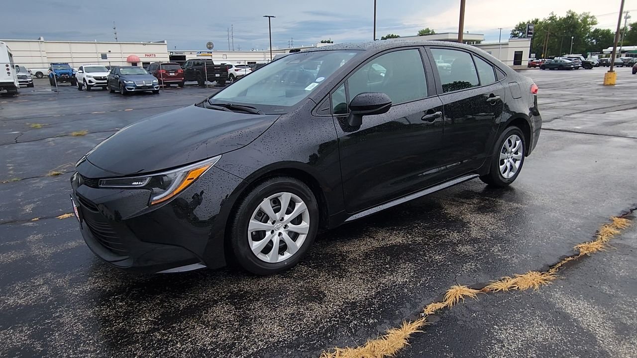 Used 2025 Midnight Black Metallic Toyota LE image 4