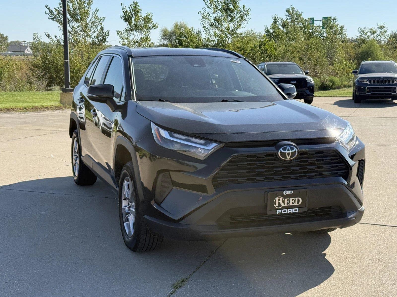 Certified Used 2025 Midnight Black Metallic Toyota XLE image 2