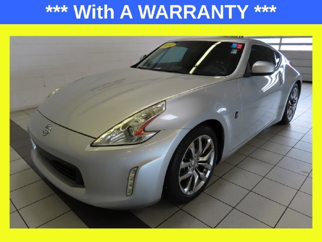 Used 2014 Brilliant Silver Metallic Nissan Base image 1