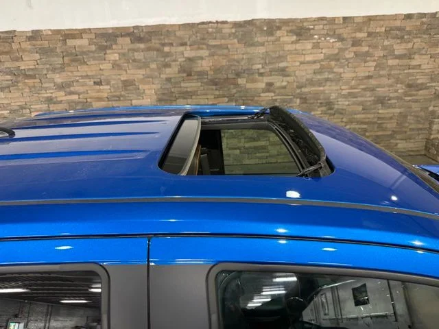 Used 2023 Blue Metallic GMC AT4 image 2