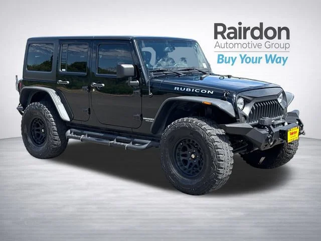 Used 2014 Black Clearcoat Jeep Unlimited Rubicon image 1