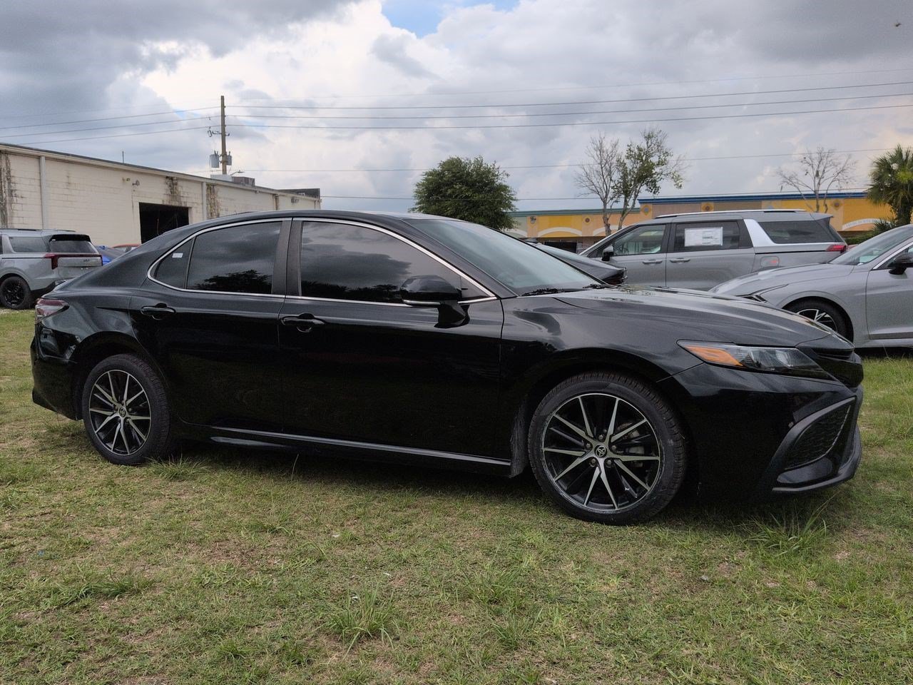 Used 2023 Midnight Black Metallic Toyota SE image 1