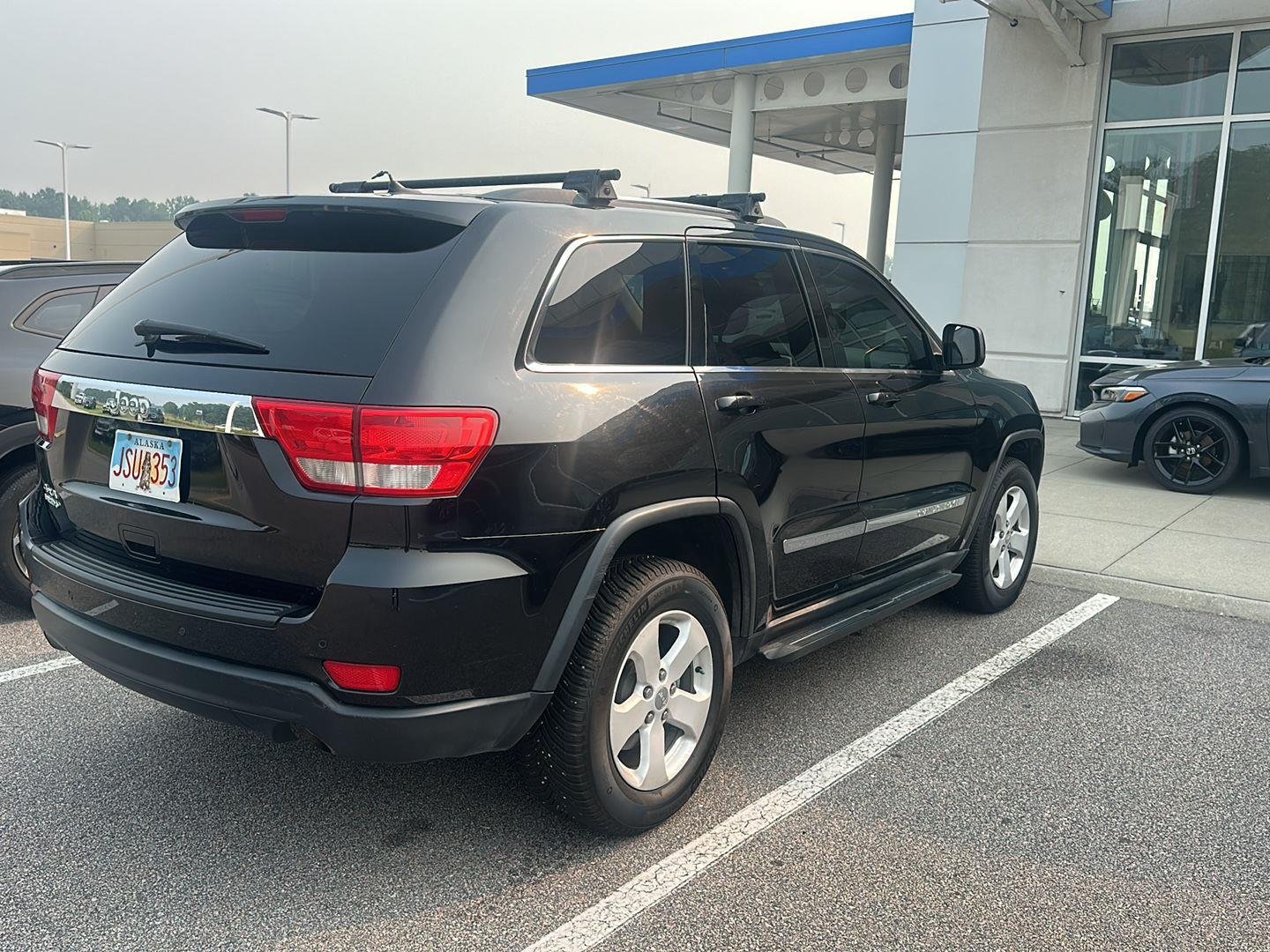 Used 2011 Brilliant Black Crystal Pearl Jeep Laredo image 3