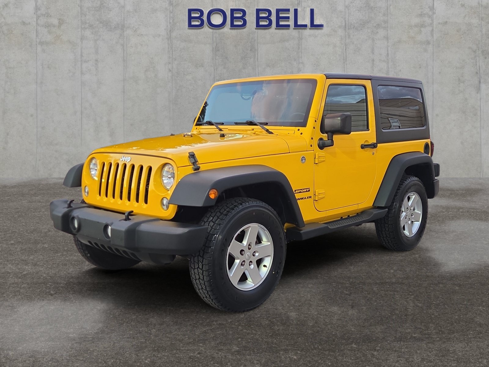 Used 2015 Baja Yellow Clearcoat Jeep Sport image 1