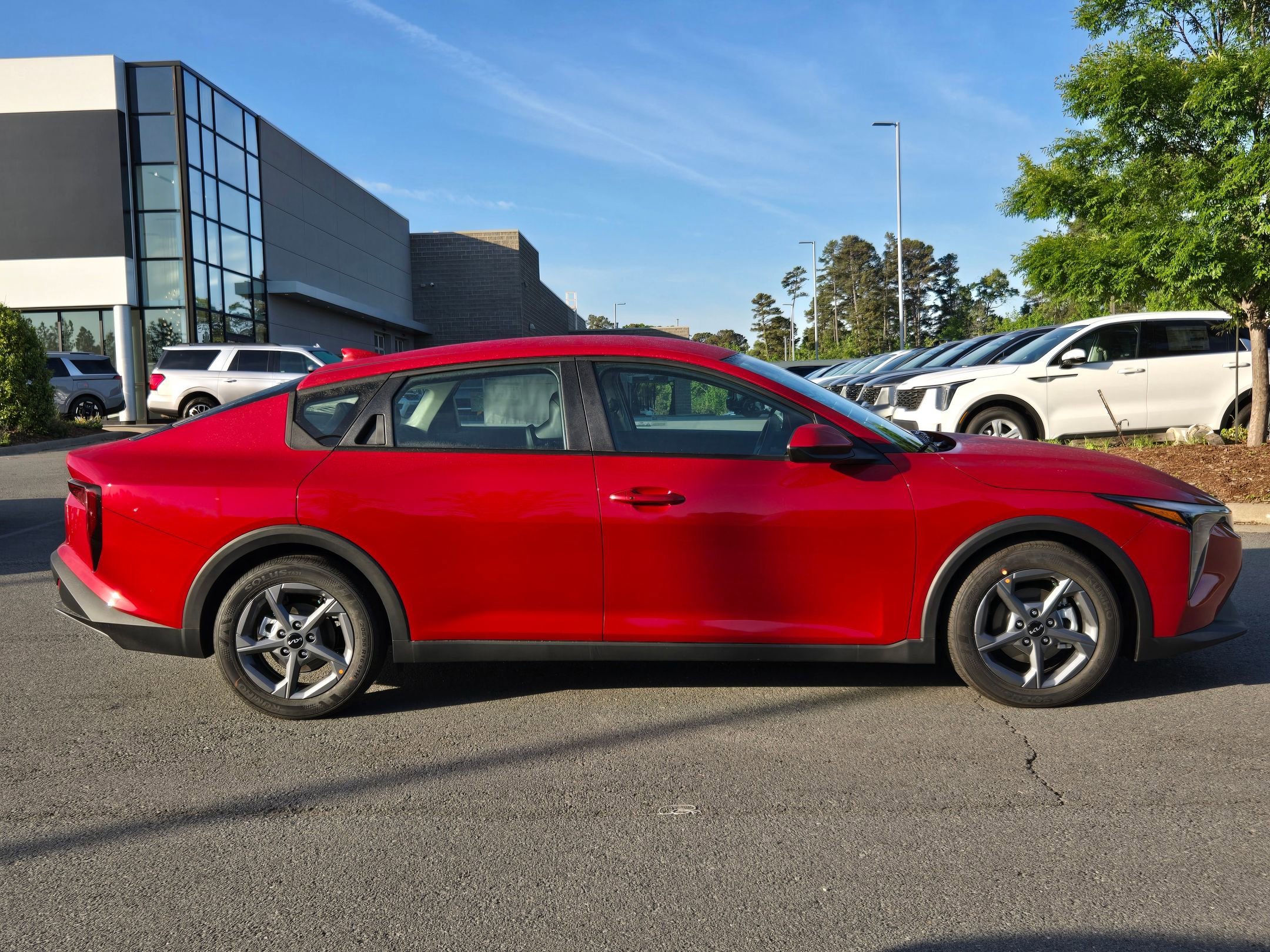 New 2026 Currant Red Kia LXS image 8