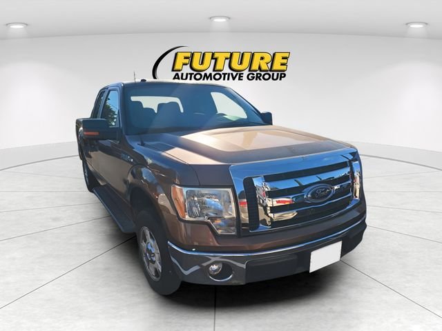 Used 2012 Gold Ford XLT image 1