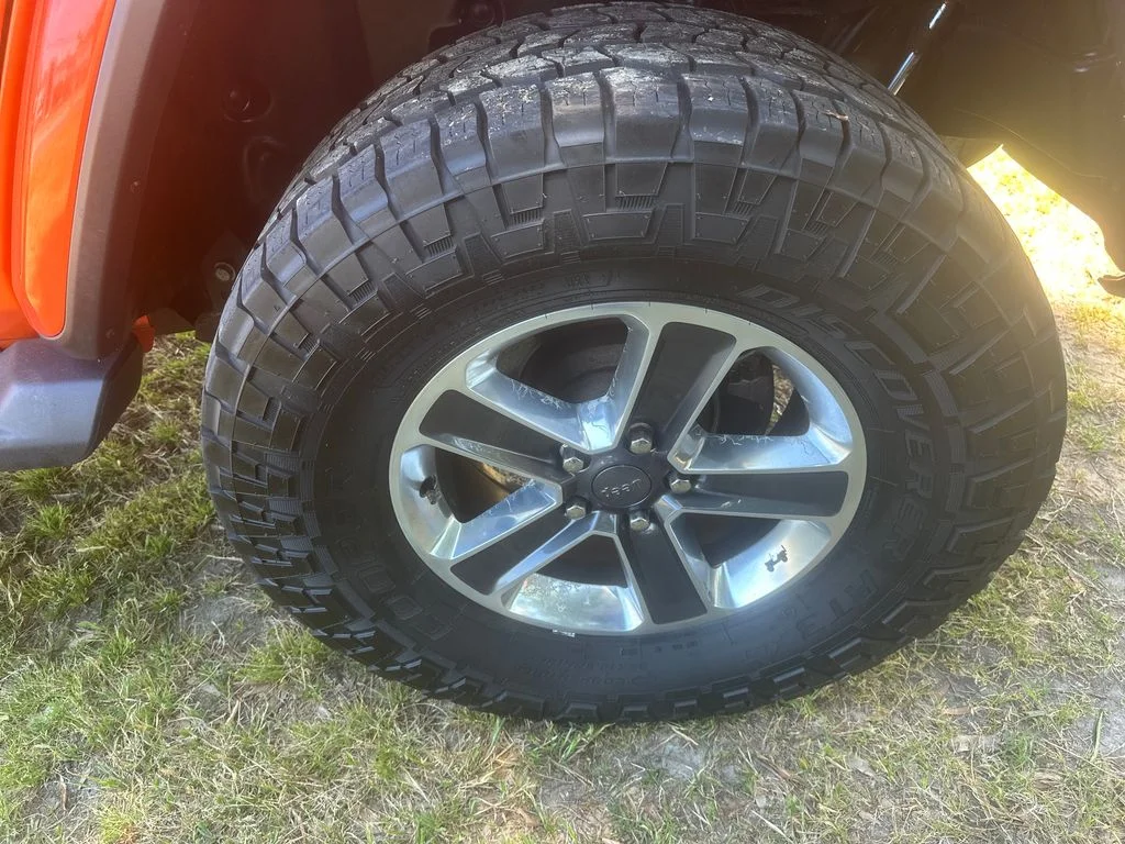 Used 2018 Orange Jeep Unlimited Sahara image 9