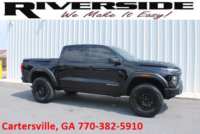 Used 2024 Onyx Black GMC 4WD AT4X image 1
