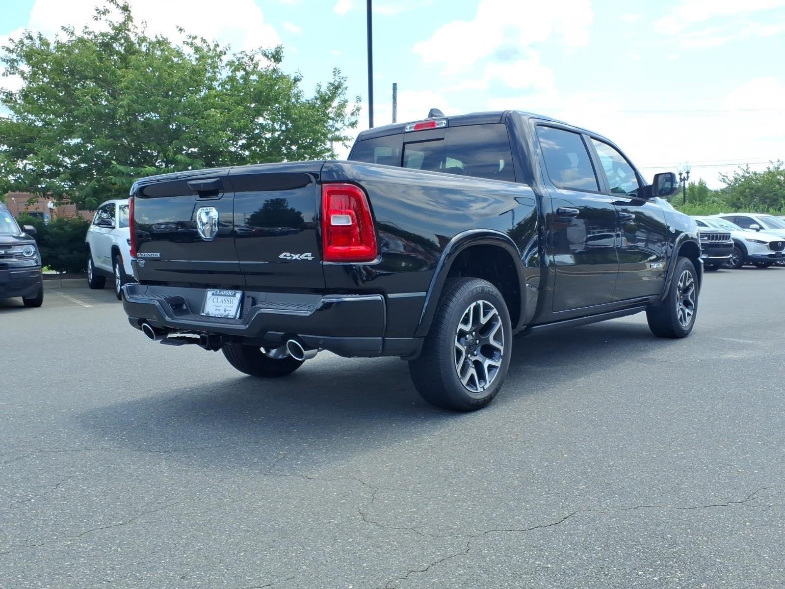 New 2026 Diamond Black Crystal Pearl-Coat Exterior Paint RAM Laramie image 2