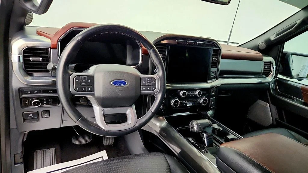 Used 2023 Agate Black Metallic Ford LARIAT 4WD SuperCrew 5.5