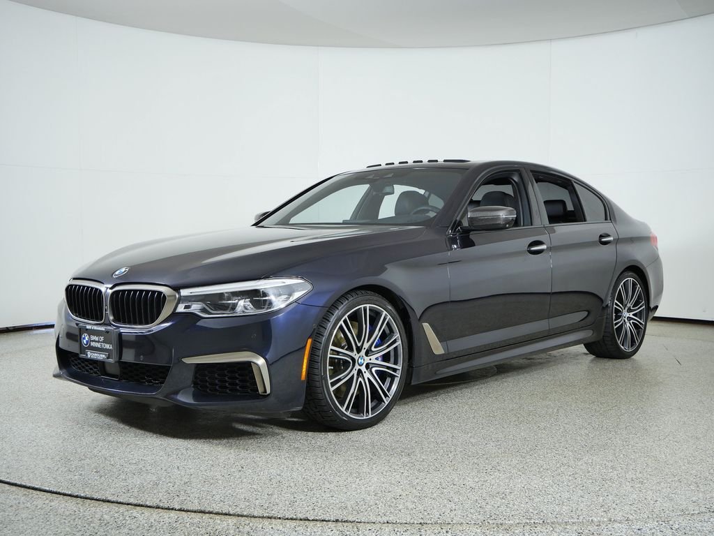 Used 2018 Carbon Black Metallic BMW M550i xDrive image 1