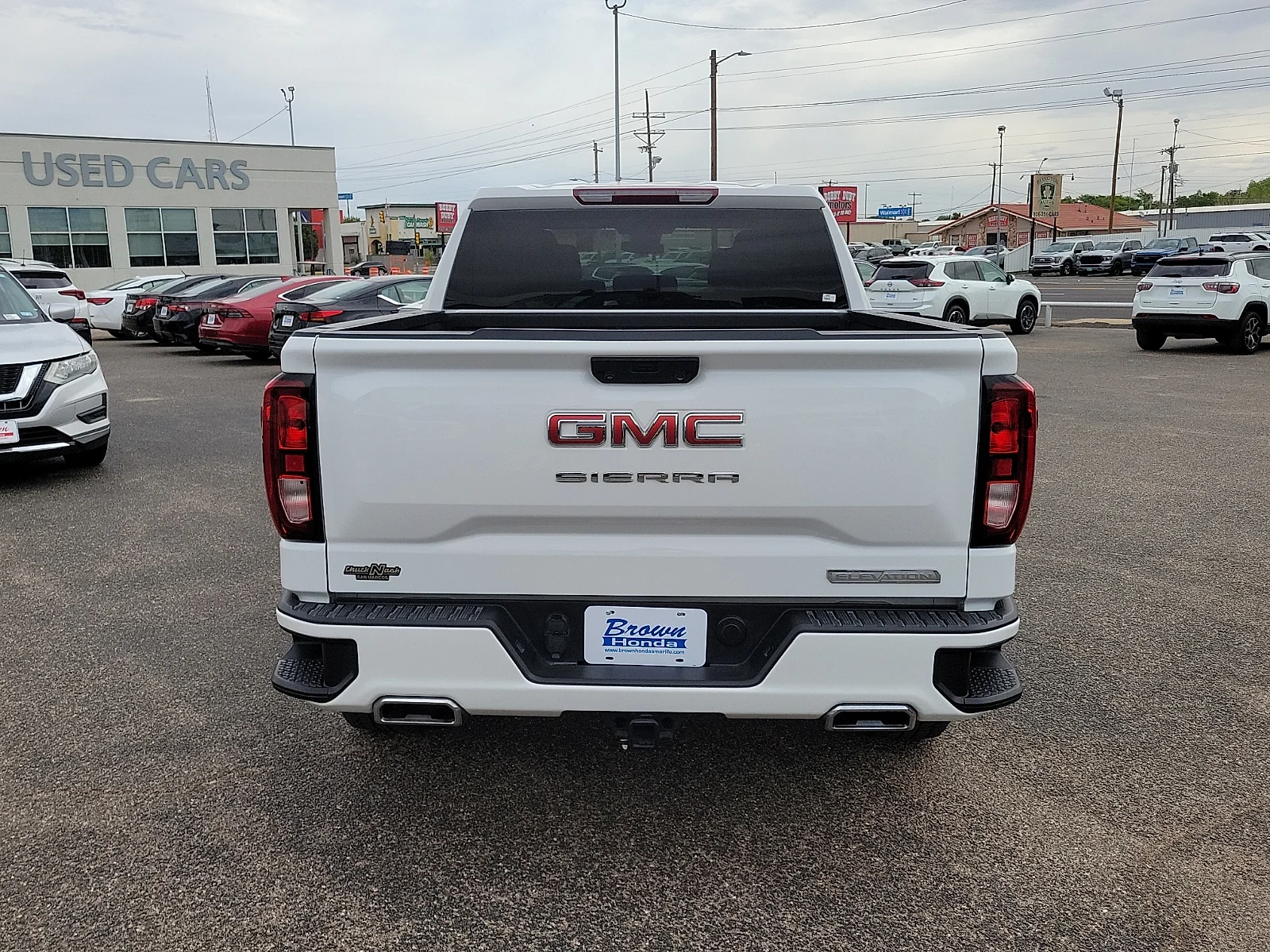 Certified Used 2024 Summit White GMC 4WD Crew Cab Short Box Elevation with 3SB image 9