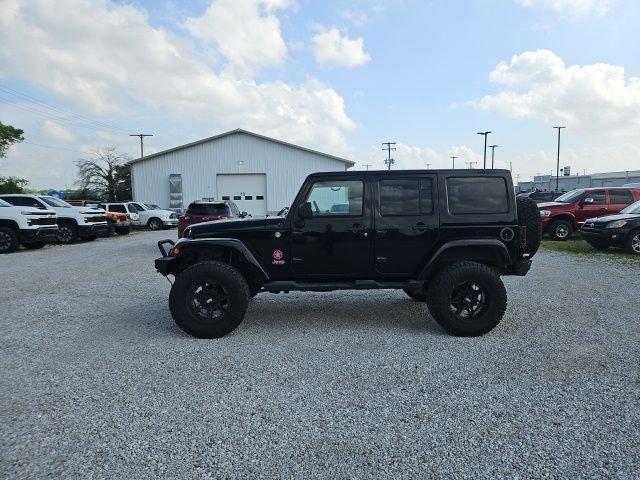 Used 2013 Black Jeep Unlimited Sahara image 9