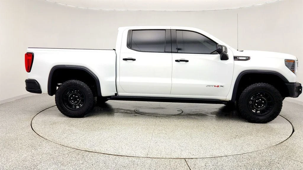 Used 2024 Summit White GMC 4WD Crew Cab 147"" AT4X image 4