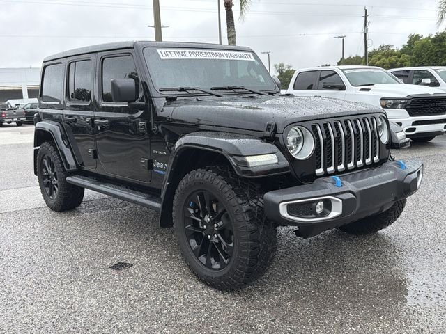 Used 2022 Jeep Wrangler Unlimited Sahara 4XE with VIN 1C4JJXP61NW232633 for sale in Dade City, FL