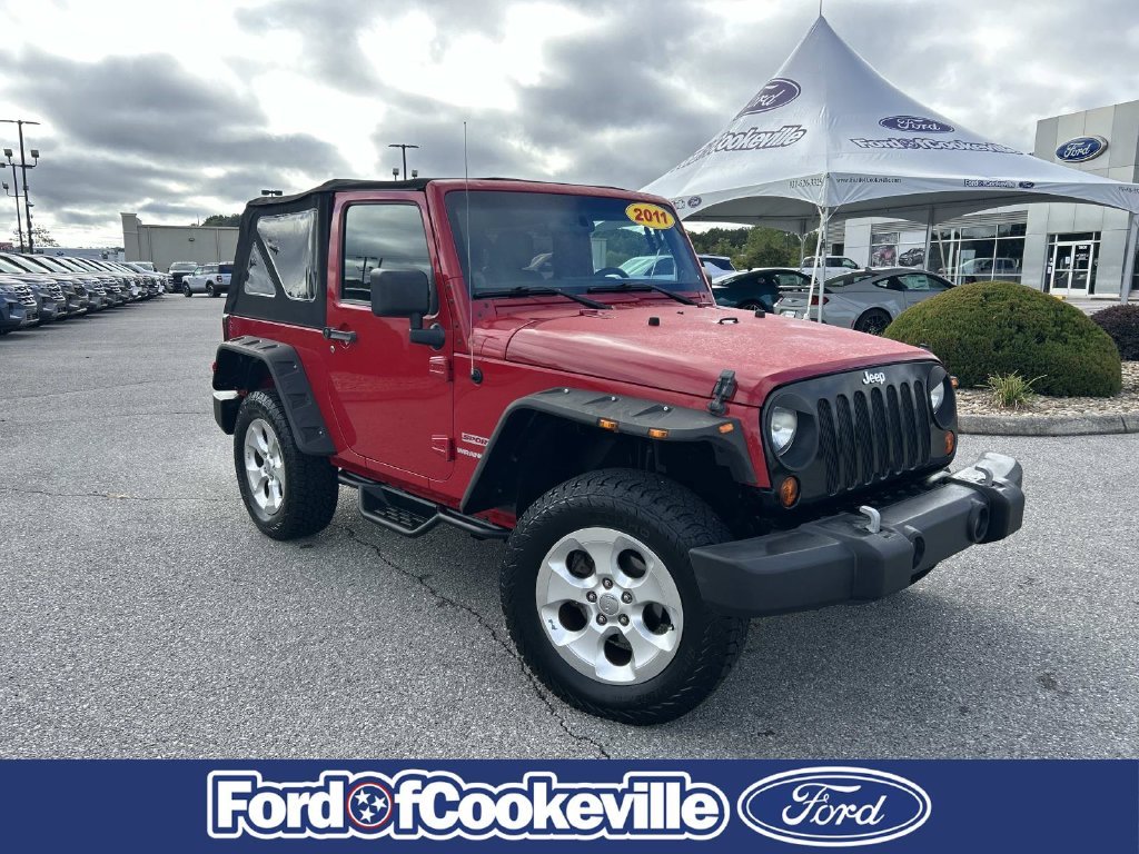 Used 2011 Flame Red Jeep Sport image 1