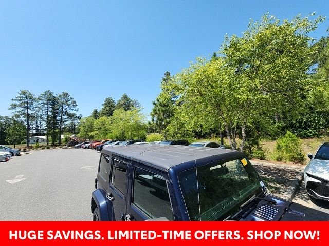 Used 2013 Blue Jeep Unlimited Sport image 22