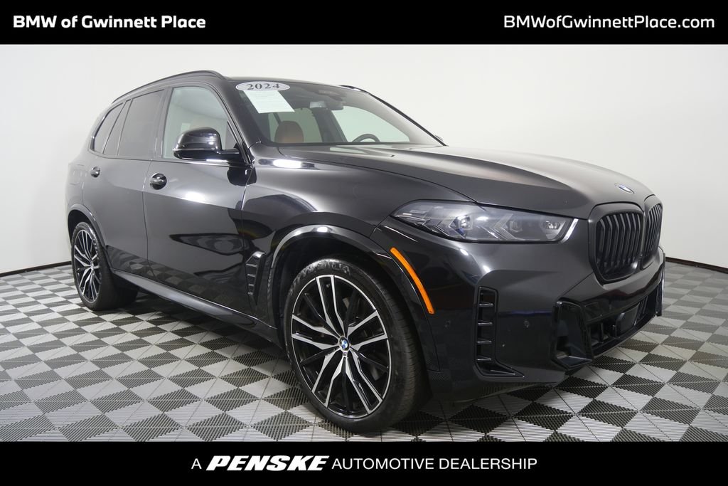 Certified Used 2024 Black Sapphire Metallic BMW xDrive40i image 1