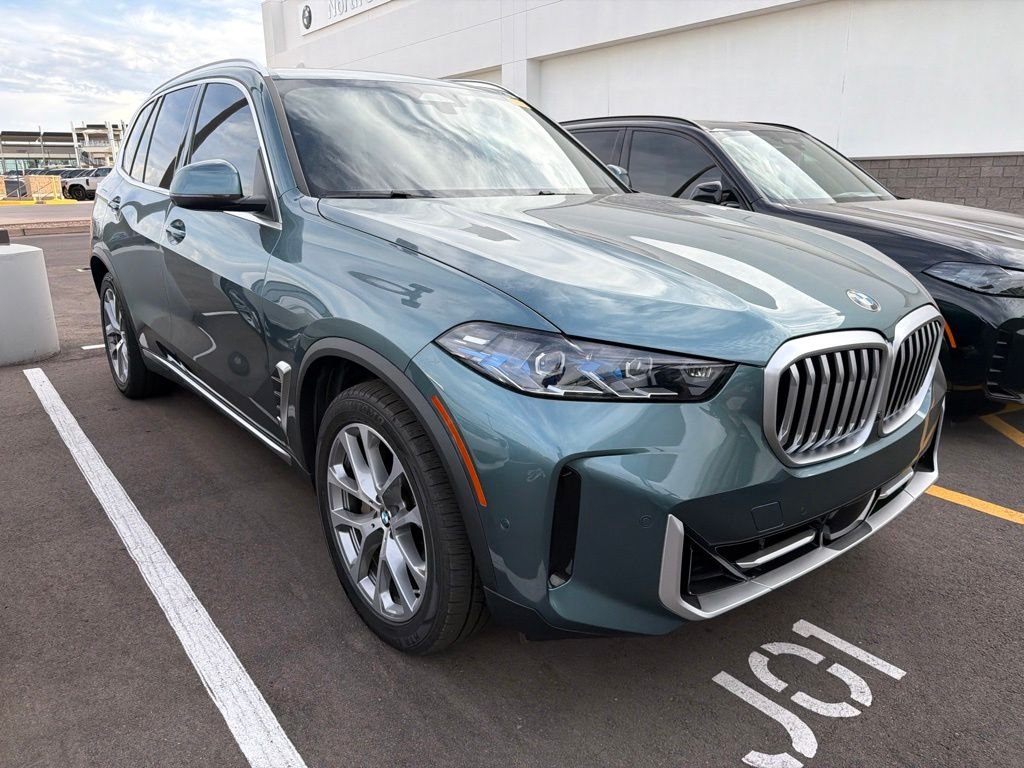 Certified Used 2024 Blue BMW xDrive40i image 2