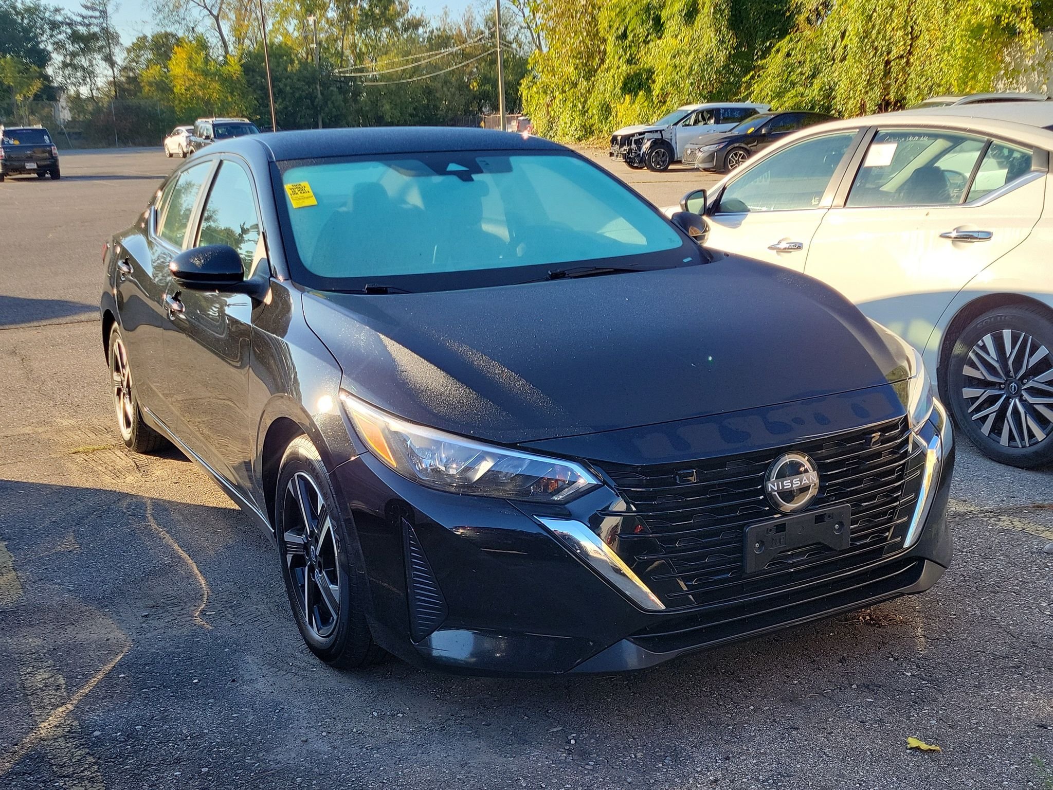 Used 2024 Super Black Nissan SV image 1