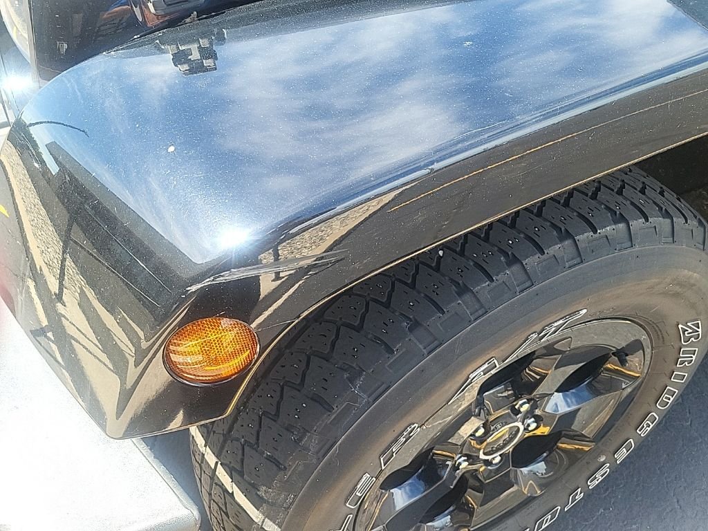 Used 2015 Black Clearcoat Jeep Sahara Altitude image 9