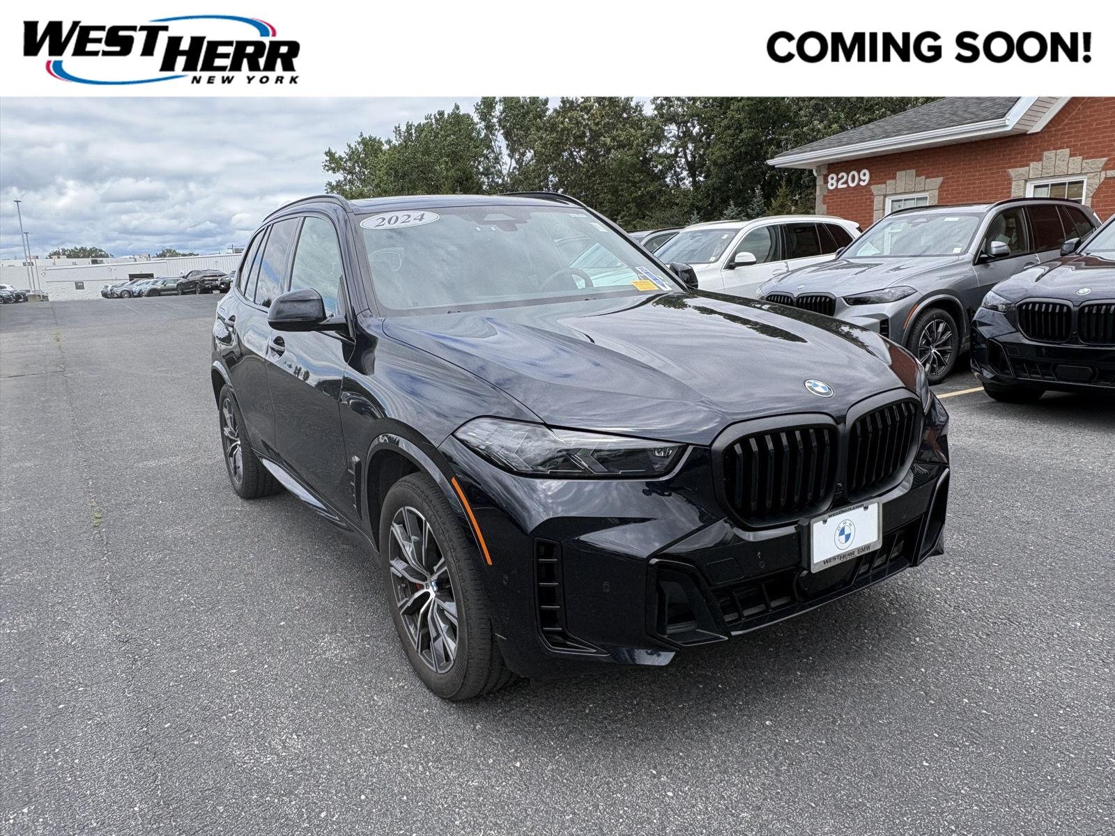 Used 2024 Carbon Black Metallic BMW xDrive40i image 1