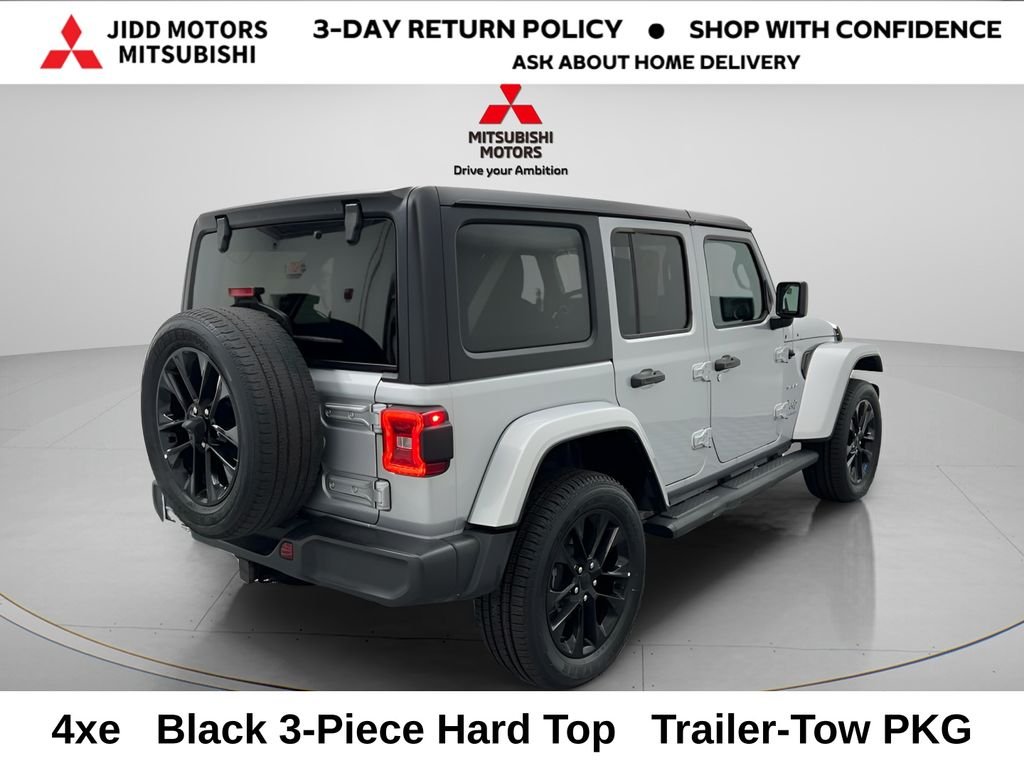 Used 2023 Jeep Wrangler 4xe Sahara 4XE with VIN 1C4JJXP65PW661003 for sale in Des Plaines, IL