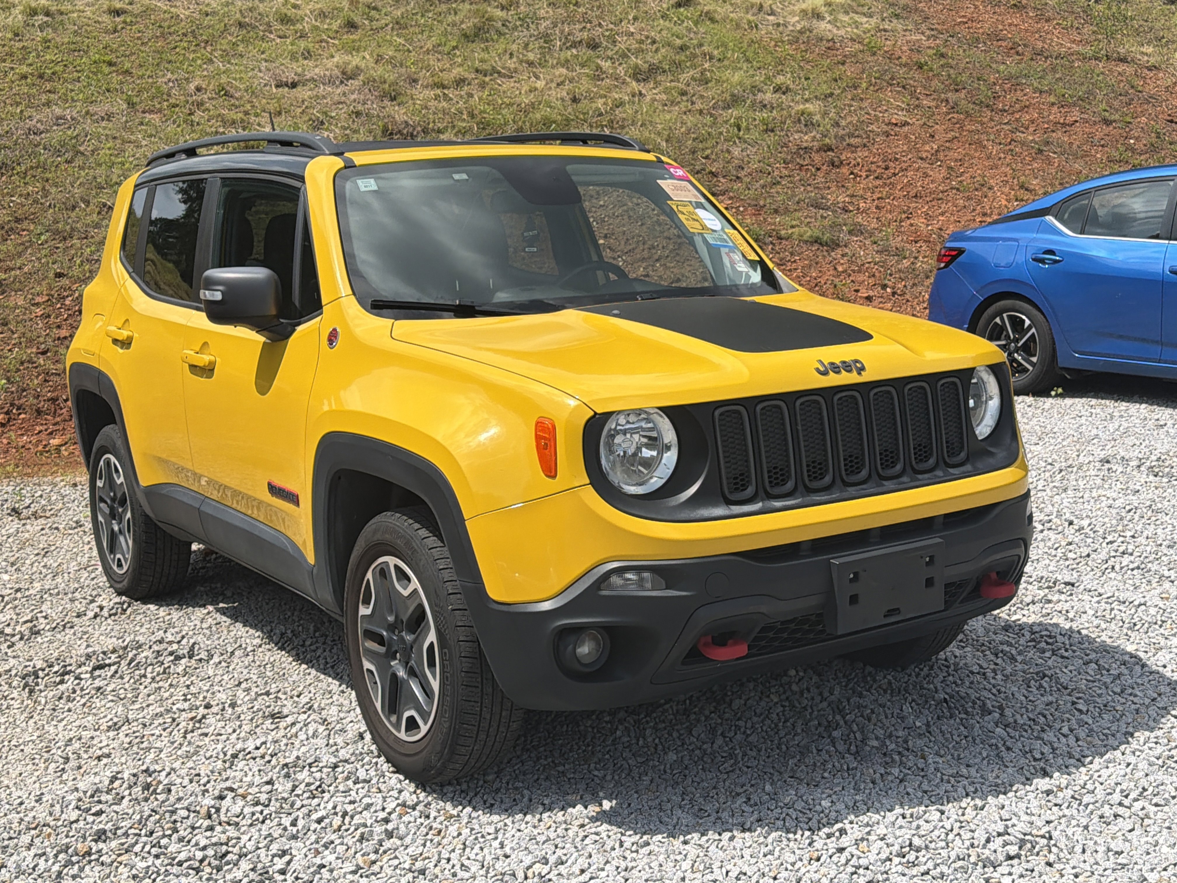 Used 2017 Solar Yellow Jeep Trailhawk image 1