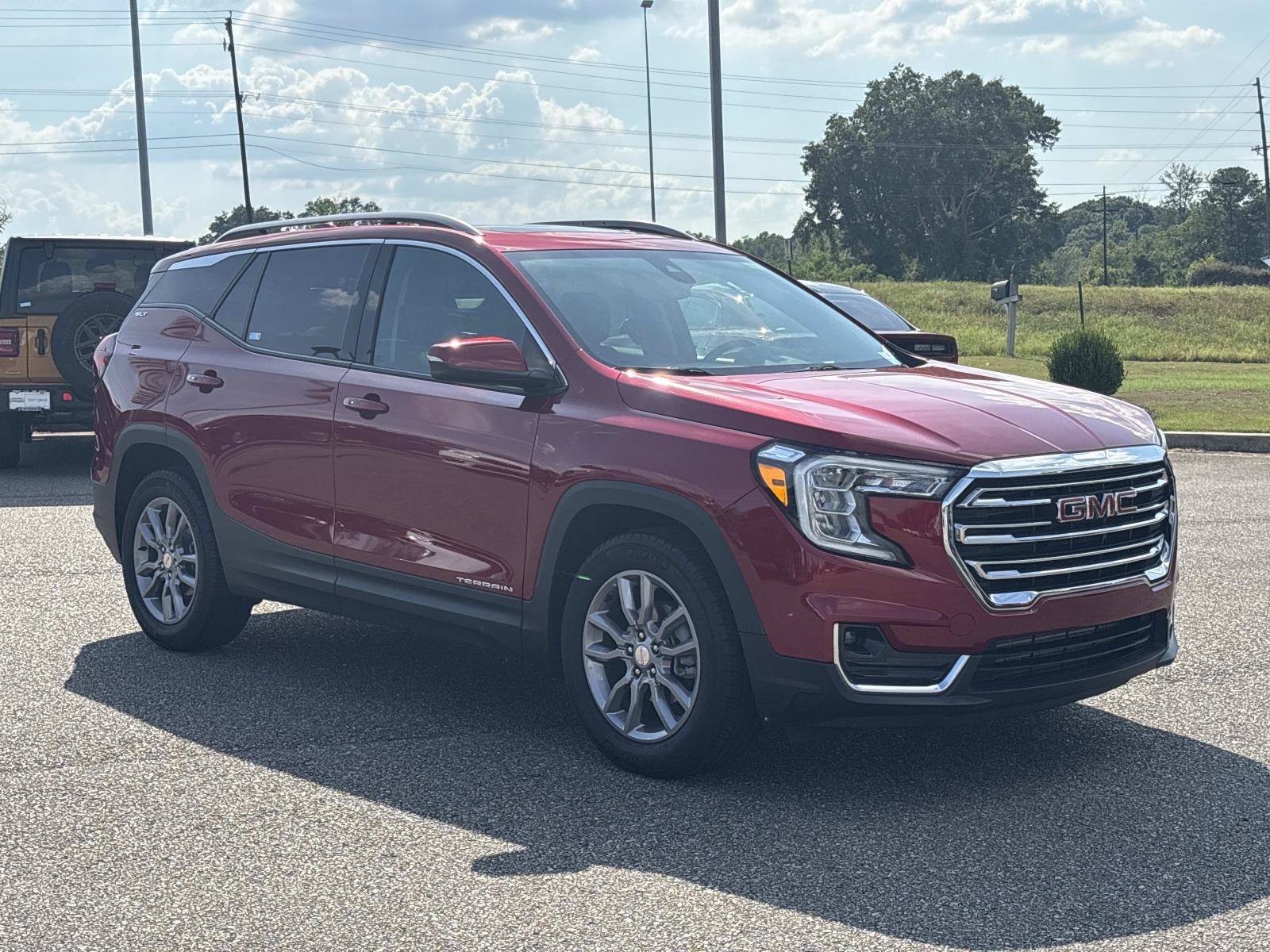 Used 2024 Volcanic Red Tintcoat GMC SLT image 3