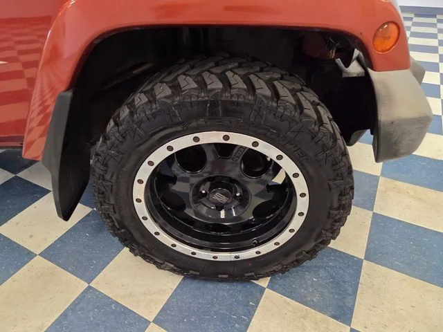 Used 2009 Orange Jeep Unlimited Sahara image 9
