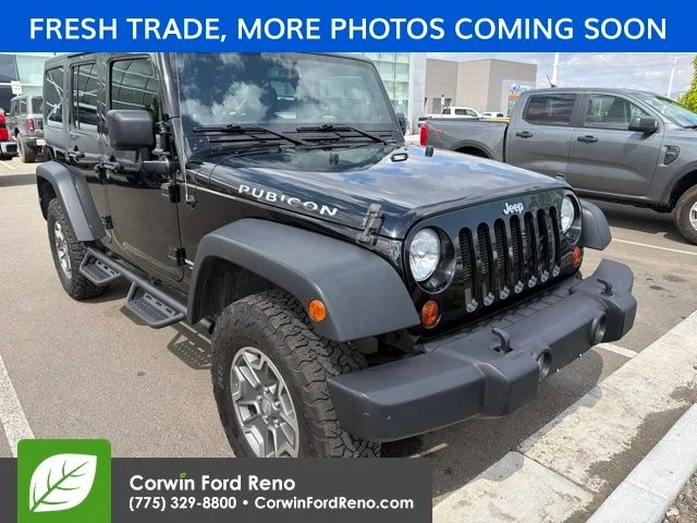 Used 2013 Black Clearcoat Jeep Unlimited Rubicon image 1
