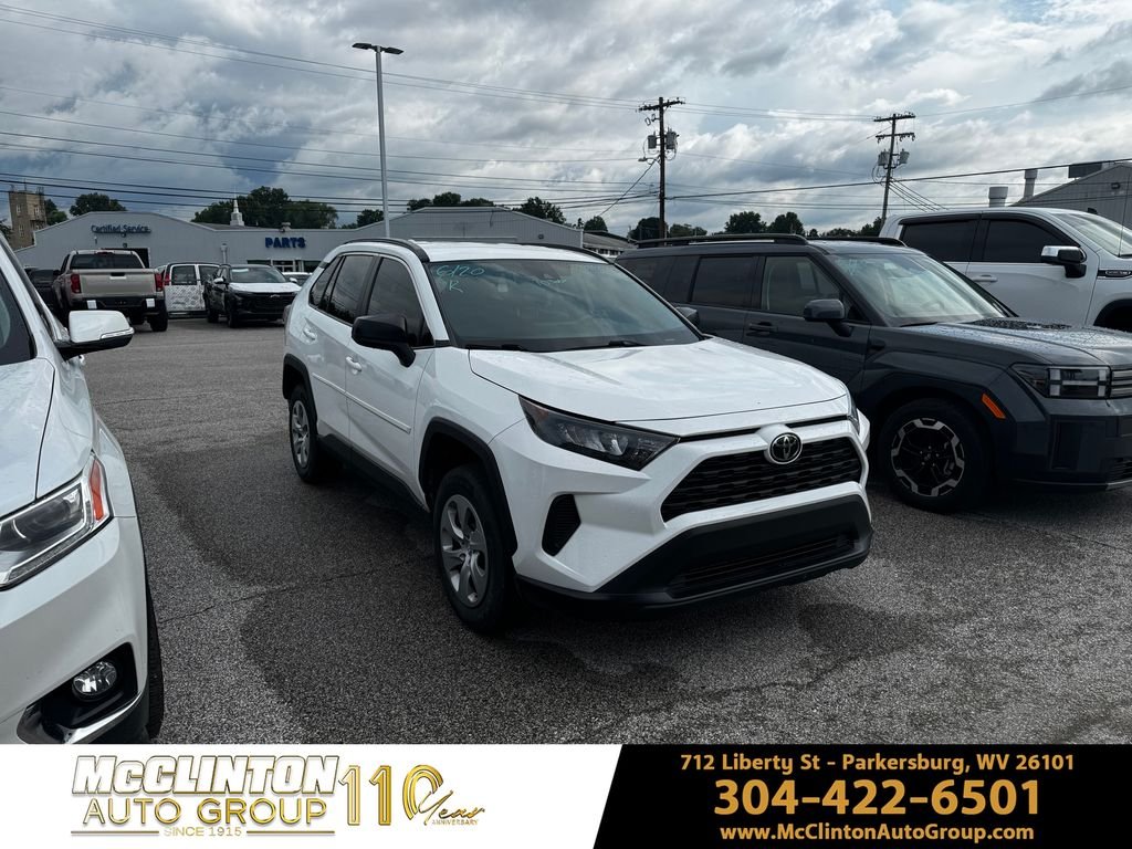 Used 2021 White Toyota LE image 1