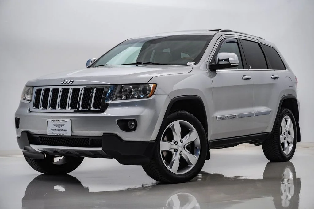 Used 2011 Bright Silver Metallic Jeep Overland image 1