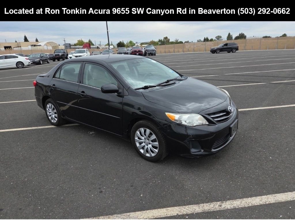 Used 2013 Black Sand Pearl Toyota LE image 1