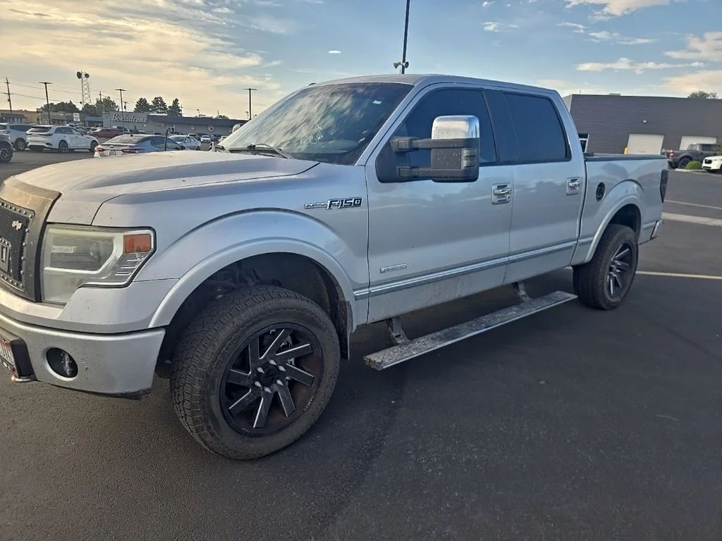 Used 2013 Ingot Silver Metallic Ford  image 1