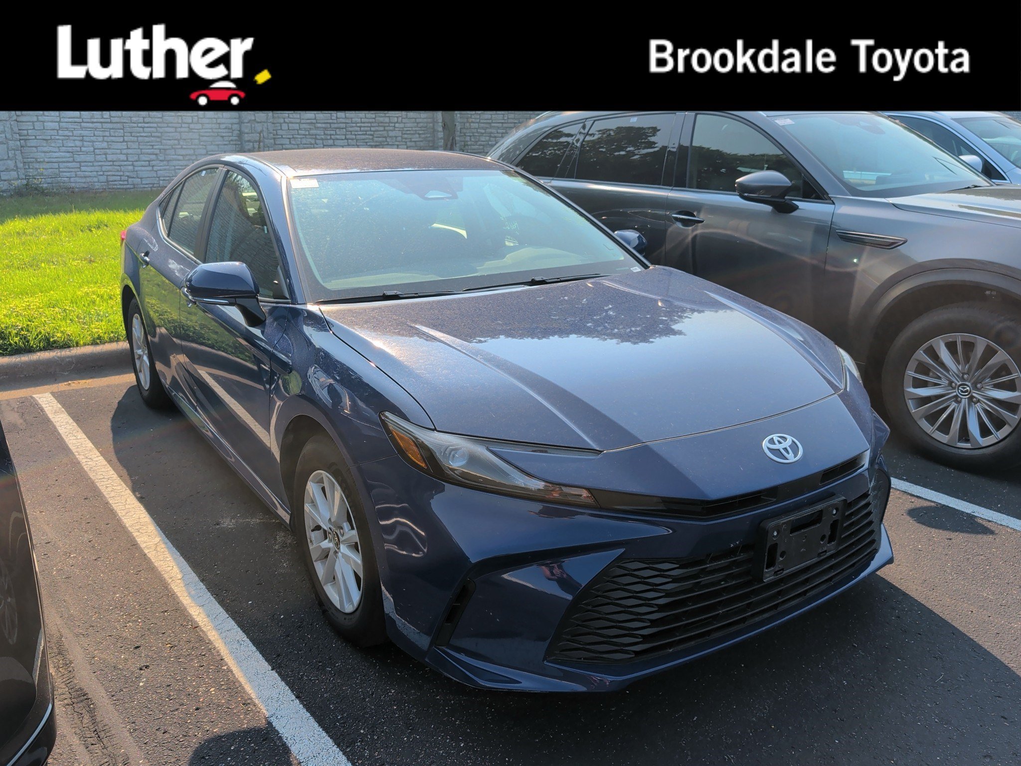 Used 2026 Reservoir Blue Toyota LE image 1