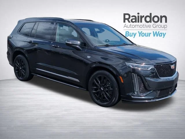 Used 2021 Stellar Black Metallic Cadillac Sport image 1