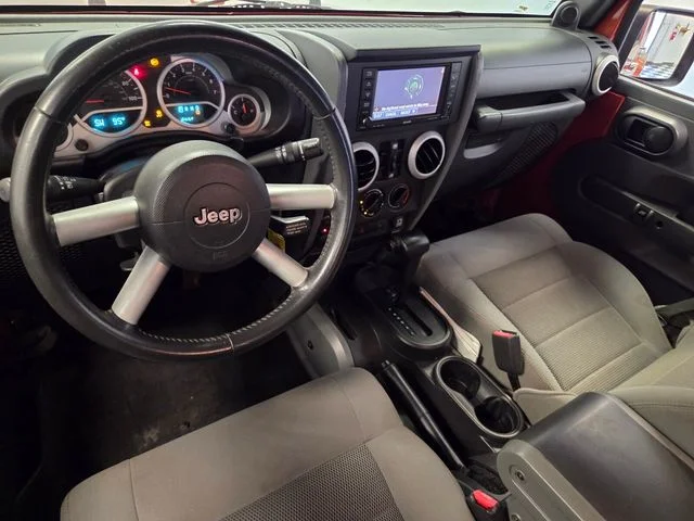 Used 2009 Orange Jeep Unlimited Sahara image 13